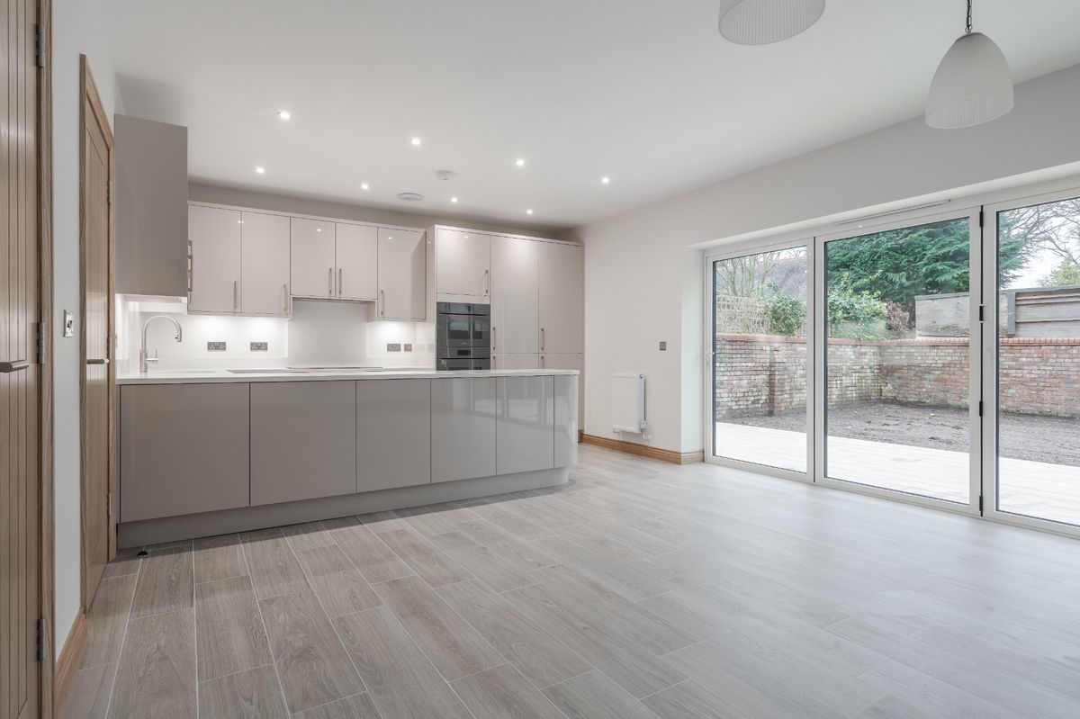 Handleless kitchen with bifold doors at Calder Drive